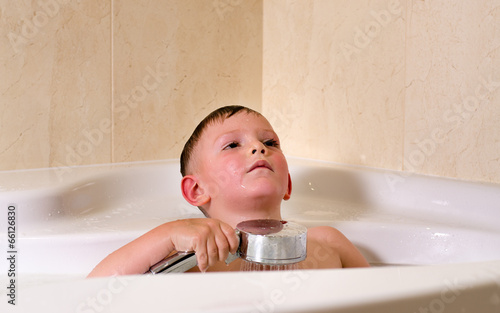 Photo: Boy having a relaxing bath Boy having a relaxing bath