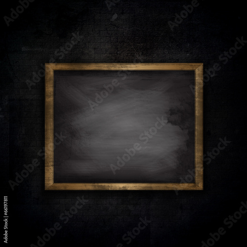 Illustration: Grunge brick wall background with chalkboard Grunge brick wall background with chalkboard
