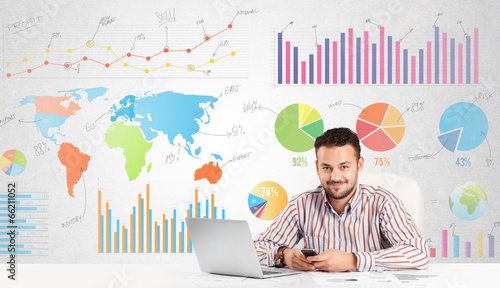 Photo: Business man with colorful charts Business man with colorful charts