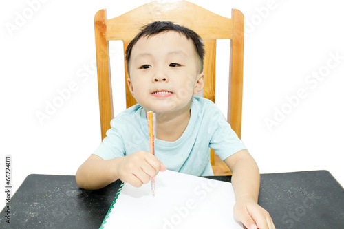 Photo: Children doing homework on a desk Children doing homework on a desk
