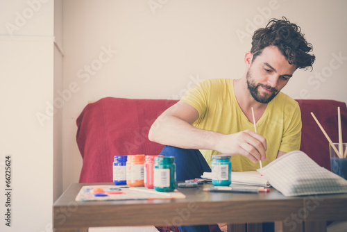 Photo: handsome hipster modern man painting handsome hipster modern man painting