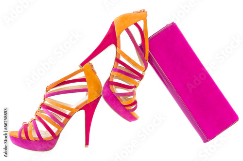Photo: Pare of pink and orange shoes and a matching bag, isolated on wh Pare of pink and orange shoes and a matching bag, isolated on wh