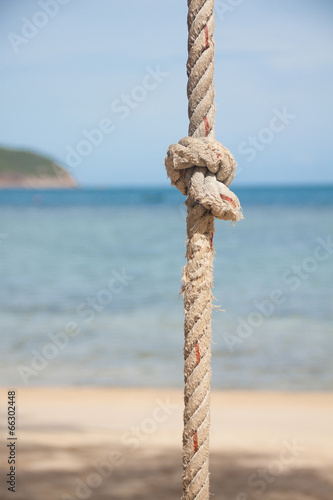 Photo: knot on the rope and sea knot on the rope and sea