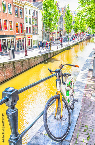 Photo: Bicycle and canal in Amsterdam Bicycle and canal in Amsterdam