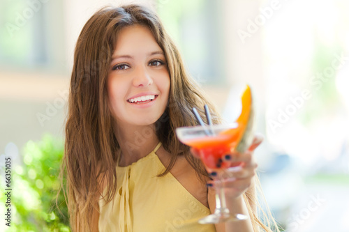 Photo: Beautiful woman having a drink Beautiful woman having a drink