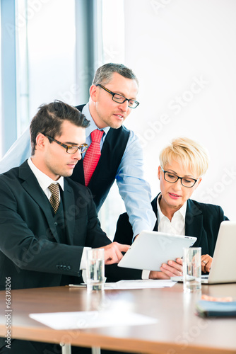 Photo: Business - meeting in office, people working with document Business - meeting in office, people working with document