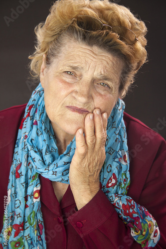 Photo: Senior woman having tooth ache Senior woman having tooth ache