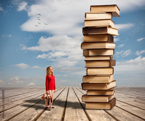 Photo: The little girl and books The little girl and books