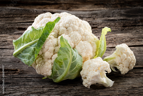 Photo: Organic cauliflower on wooden background Organic cauliflower on wooden background