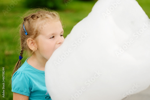 Photo: girl eating cotton candy girl eating cotton candy