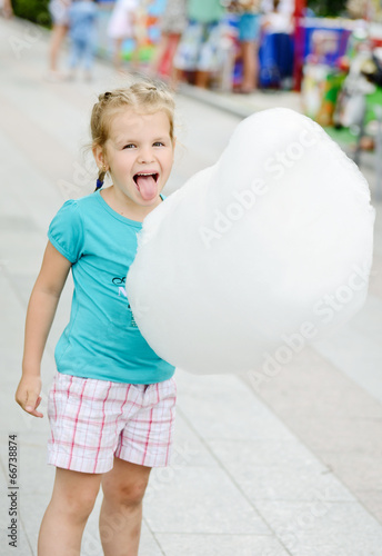 Photo: girl and cotton candy girl and cotton candy