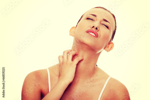 Photo: Young beautiful woman scratching her self Young beautiful woman scratching her self