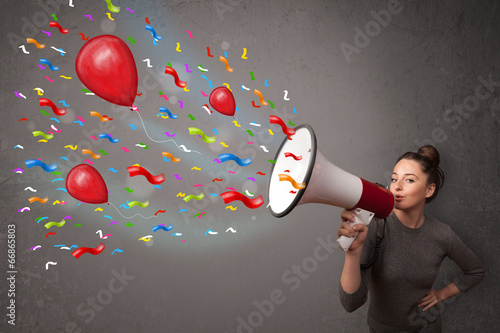 Photo: Young girl having fun, shouting into megaphone with balloons Young girl having fun, shouting into megaphone with balloons