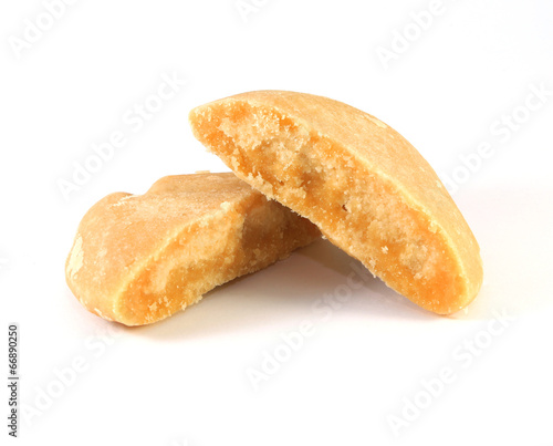 Photo: The palm sugar or Jaggery on white background The palm sugar or Jaggery on white background