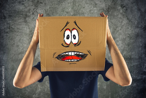 Photo: Man with cardboard box on his head and terrified look skethed Man with cardboard box on his head and terrified look skethed