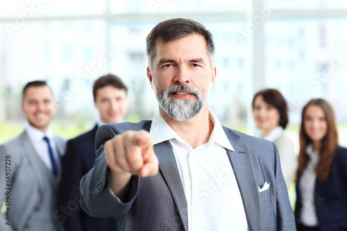 Photo: Handsome man pointing his finger at you Handsome man pointing his finger at you
