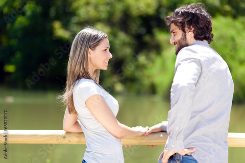 Photo: Young couple at the park Young couple at the park