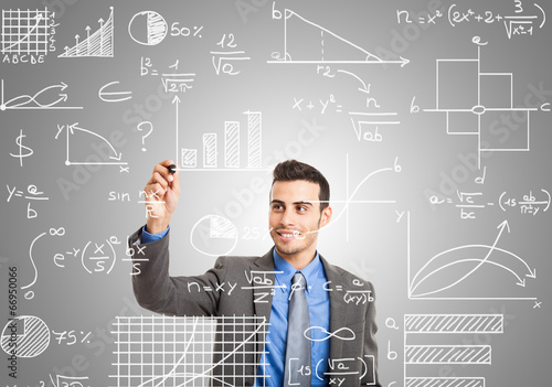 Photo: Man writing formulas on the screen Man writing formulas on the screen