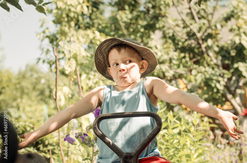 Photo: Young boy shrugging his shoulders Young boy shrugging his shoulders