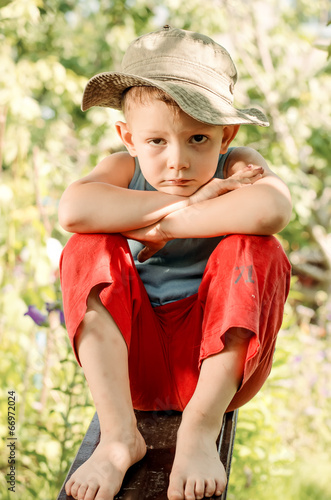 Photo: Thoughtful young boy staring at the camera Thoughtful young boy staring at the camera