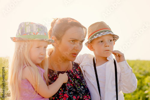 Photo: Mother with a young girl and boy Mother with a young girl and boy