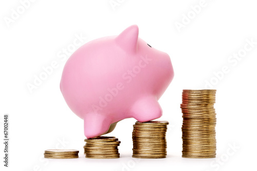 Photo: Piggy bank and coins Piggy bank and coins