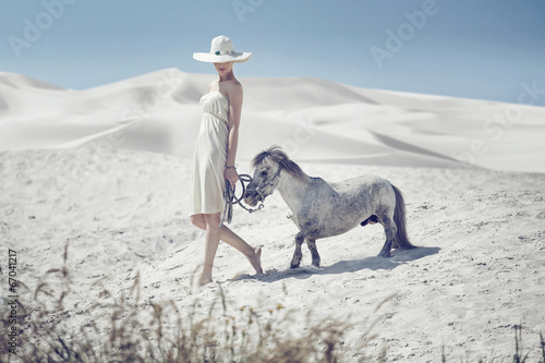 Photo: Elegant lady with the cute pony Elegant lady with the cute pony