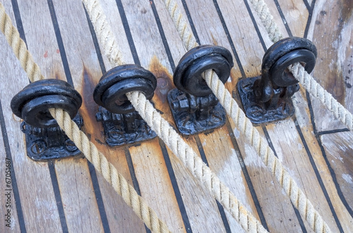 Photo: wooden sailboat pulleys and ropes wooden sailboat pulleys and ropes