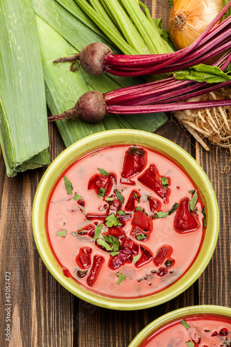 Photo: Beetroot soup with fresh vegetables in a bowl Beetroot soup with fresh vegetables in a bowl