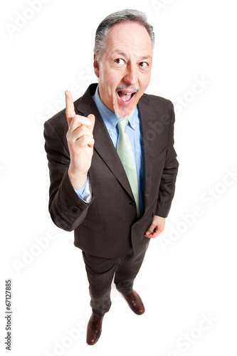 Photo: Mature full length businessman having an idea Mature full length businessman having an idea