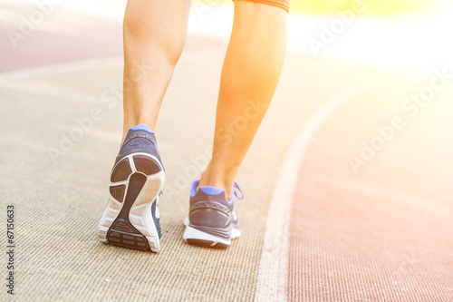 Photo: Woman Ready to Run on Track Lane Woman Ready to Run on Track Lane