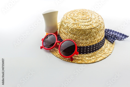 Photo: Woven hat, red sunglasses with body lotion. Woven hat, red sunglasses with body lotion.