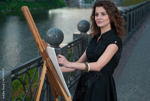 Photo: Nice young artist draws a picture Nice young artist draws a picture