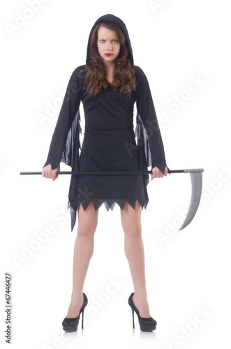 Photo: Woman in halloween concept with scythe Woman in halloween concept with scythe