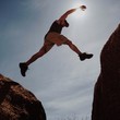 Man jumping between rocks Man jumping between rocks