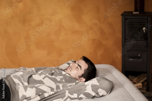 Photo: Man relaxing at home Man relaxing at home