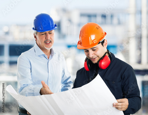 Photo: Engineer explaining a drawing Engineer explaining a drawing