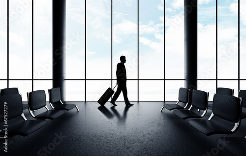 Photo: businessman walking in airport businessman walking in airport