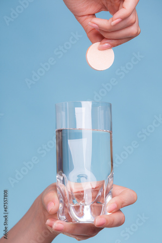 Photo: Aspirin pill tablet and glass water for headache Aspirin pill tablet and glass water for headache
