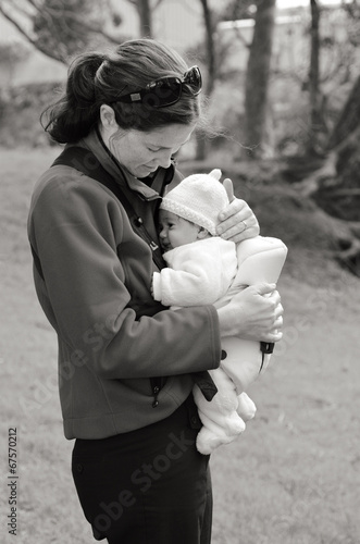 Photo: Mother carry newborn baby on baby carrier Mother carry newborn baby on baby carrier
