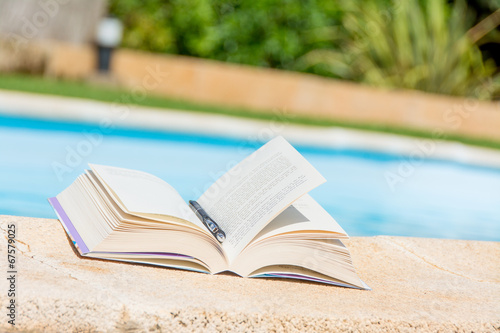 Photo: Leisure at the swimming pool with book Leisure at the swimming pool with book
