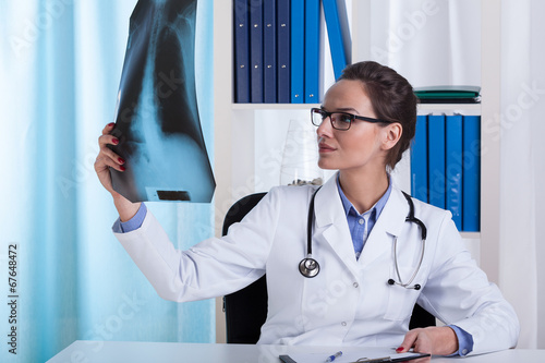 Photo: The doctor watches chest X-ray The doctor watches chest X-ray