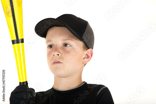 Photo: young boy baseball player looking at his bat young boy baseball player looking at his bat