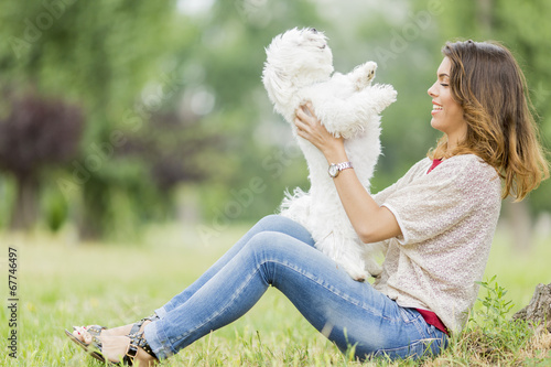Photo: Young woman with a dog Young woman with a dog