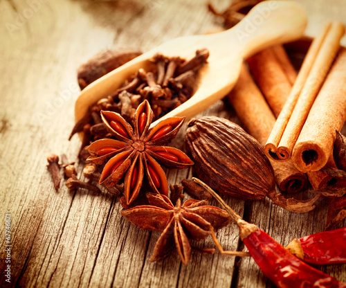 Photo: Various spices on a wooden table Various spices on a wooden table