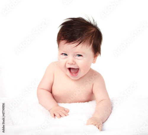 Photo: Beautiful expressive adorable happy cute laughing smiling baby Beautiful expressive adorable happy cute laughing smiling baby