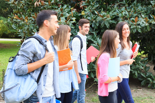 Photo: Group of students walking outdoor Group of students walking outdoor