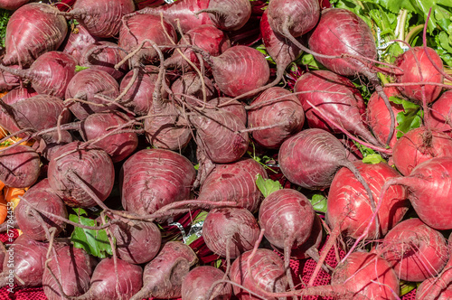 Photo: Display of red beets at the market Display of red beets at the market