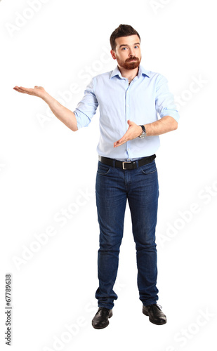 Photo: Happy business man presenting and showing Happy business man presenting and showing