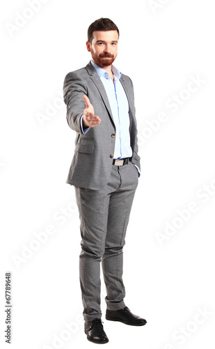 Photo: A business man with an open hand ready to seal a deal A business man with an open hand ready to seal a deal